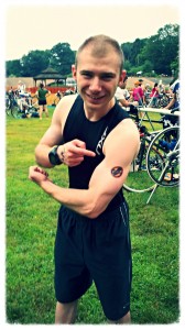 Showing off my temporary Tri Club tattoo at Transition before the race.
